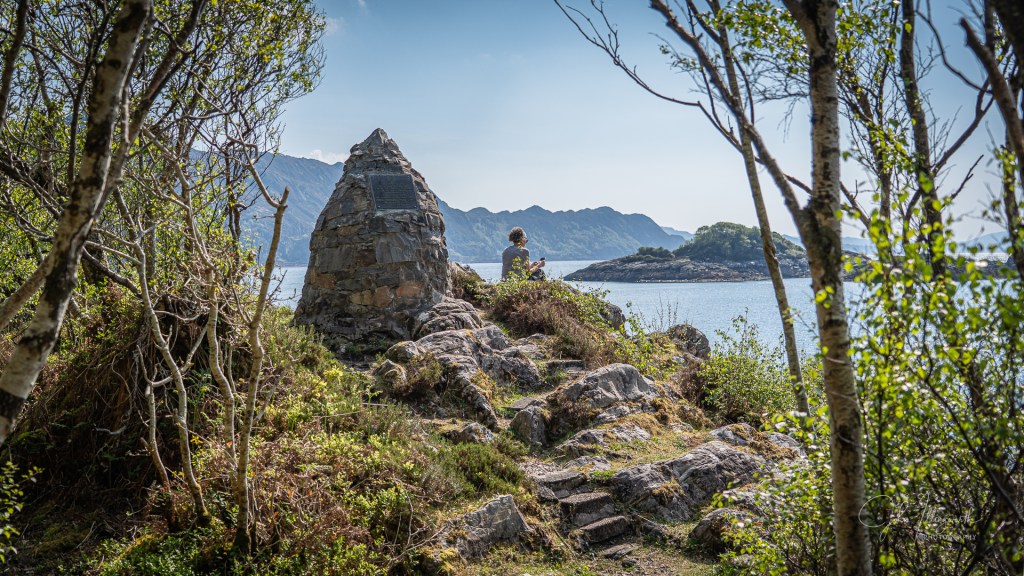 Stone Cairn in the foreground with the loch behind